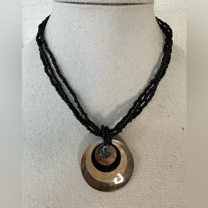 Gorgeous abalone shell pendant on black seed bead necklace